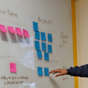 A man pointing at a board
